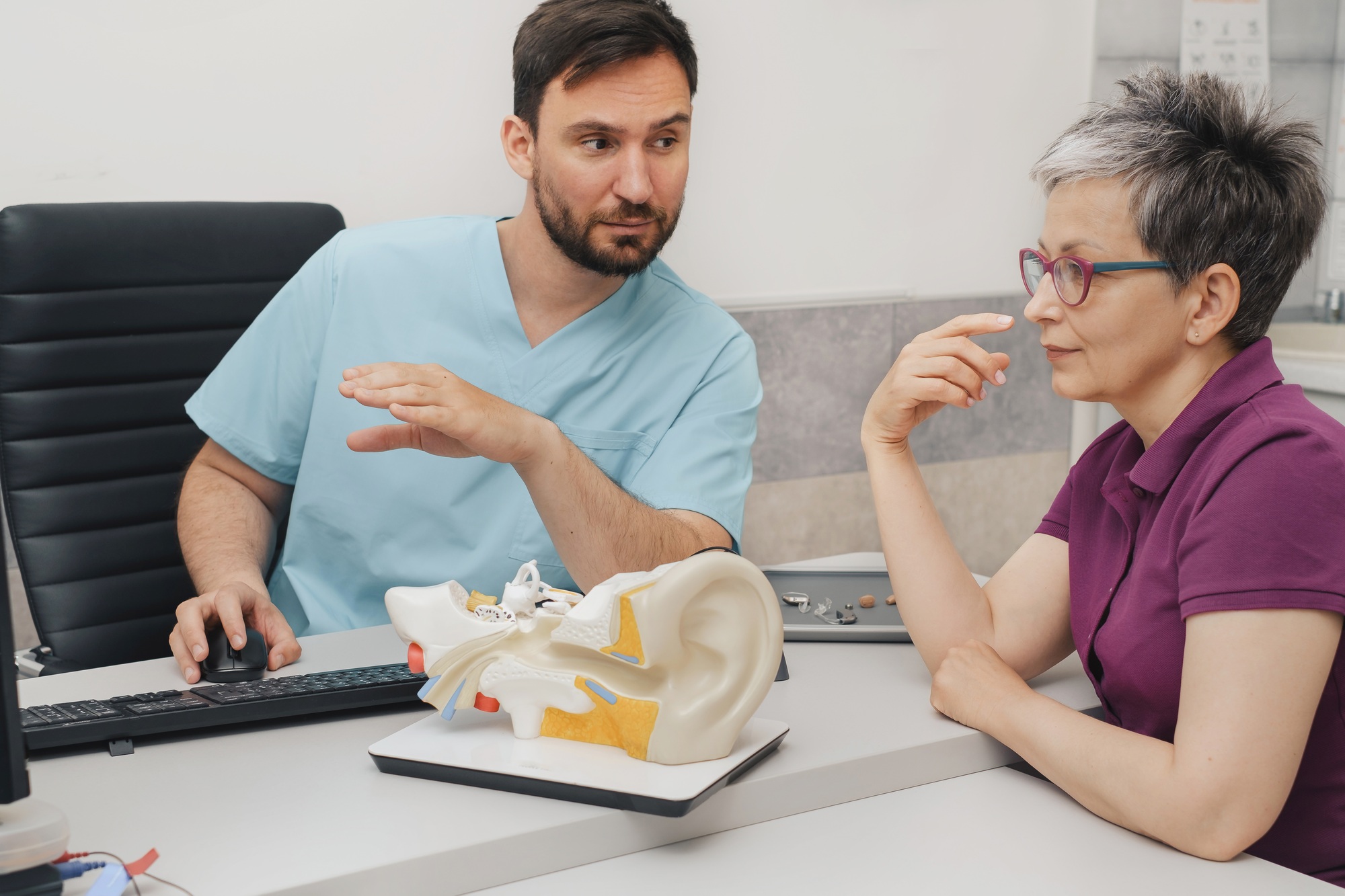 ENT Doctor consulting patient with hearing loss